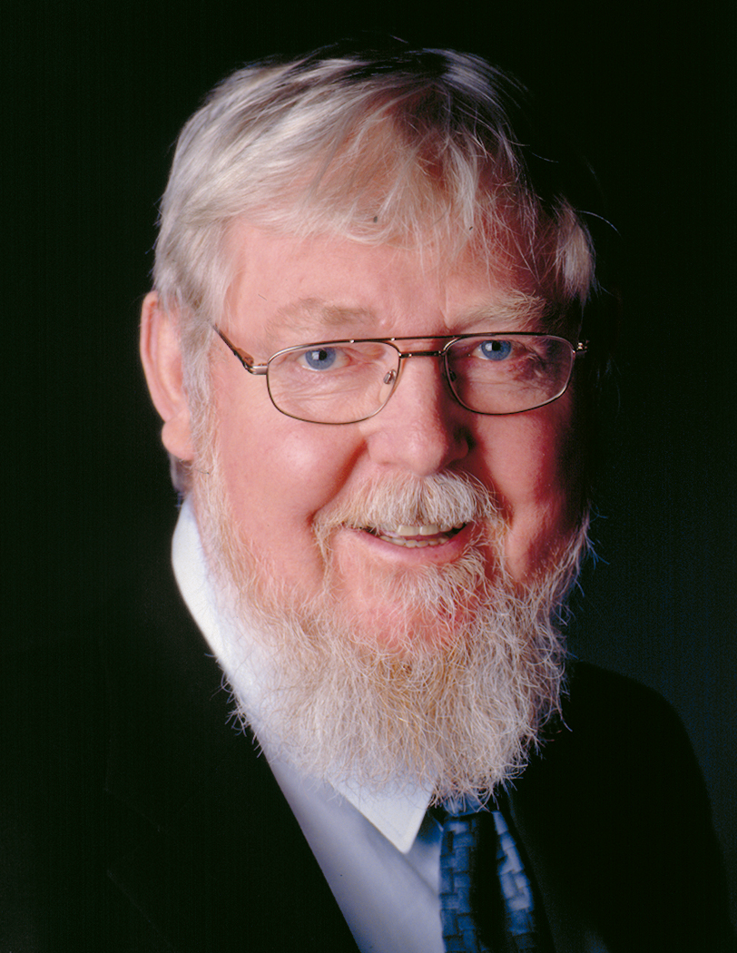 Porträtfoto einer männlichen Person mit Brille